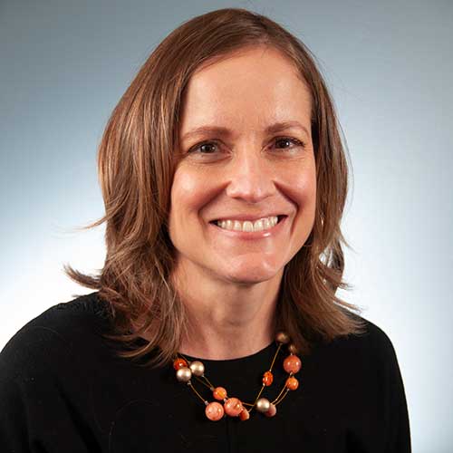 a woman smiling for the camera