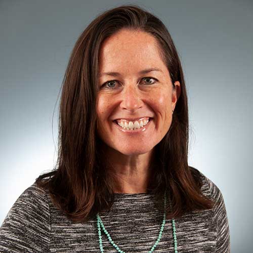 a woman smiling for the camera