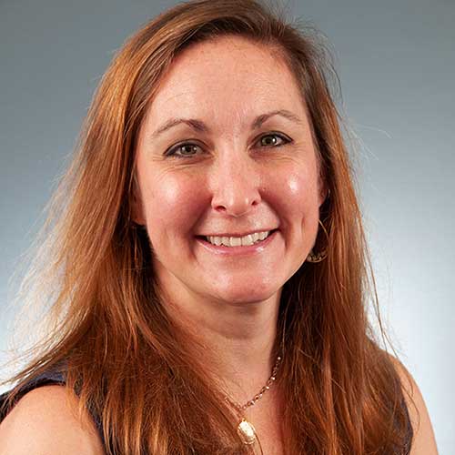 a woman smiling for the camera