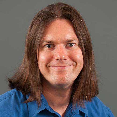 a close up of a person in a blue shirt