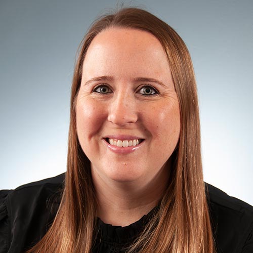 a woman smiling for the camera