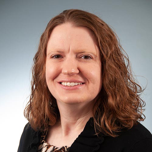 a woman smiling for the camera