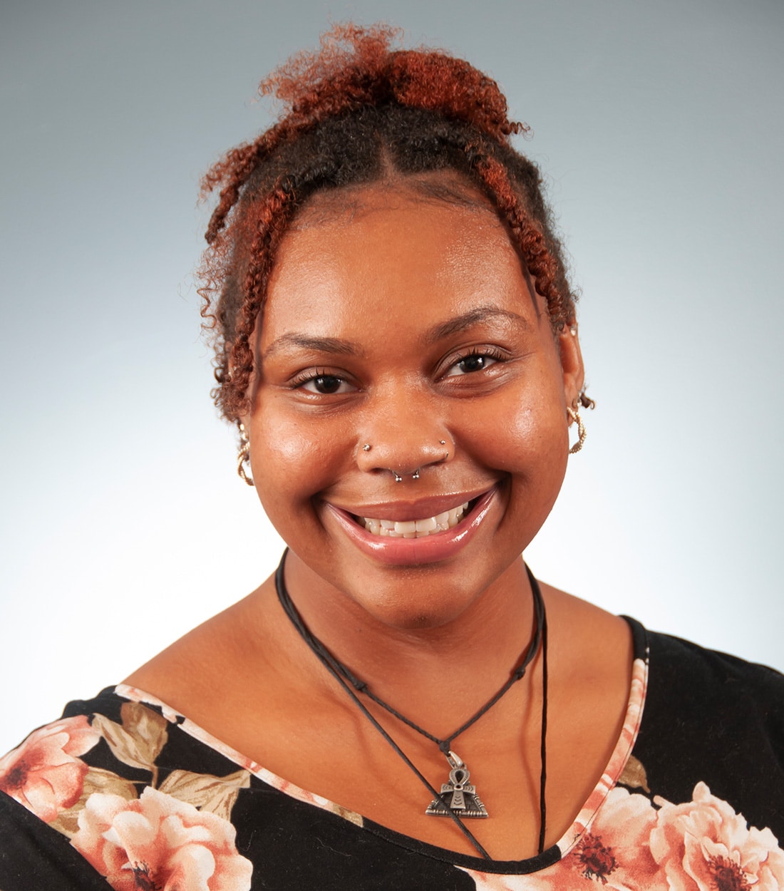 a woman wearing glasses and smiling at the camera Hadassah Gaddis