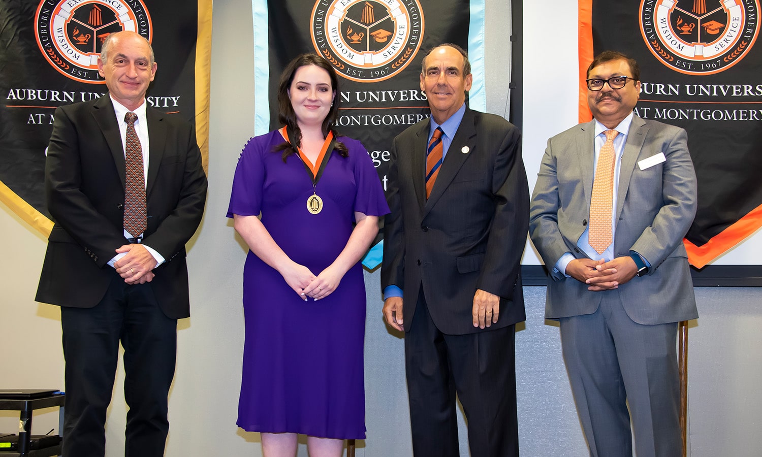 a group of people posing for a photo a group of people posing for a photo