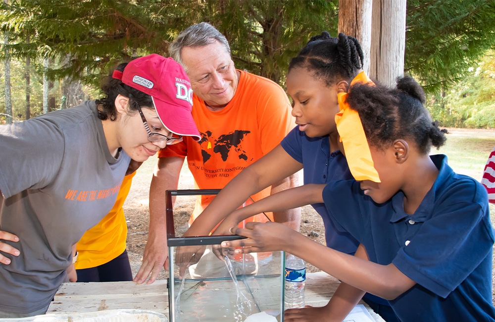 a man preparing food on a picnic table