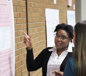 A Group Of People Standing In Front Of A Building