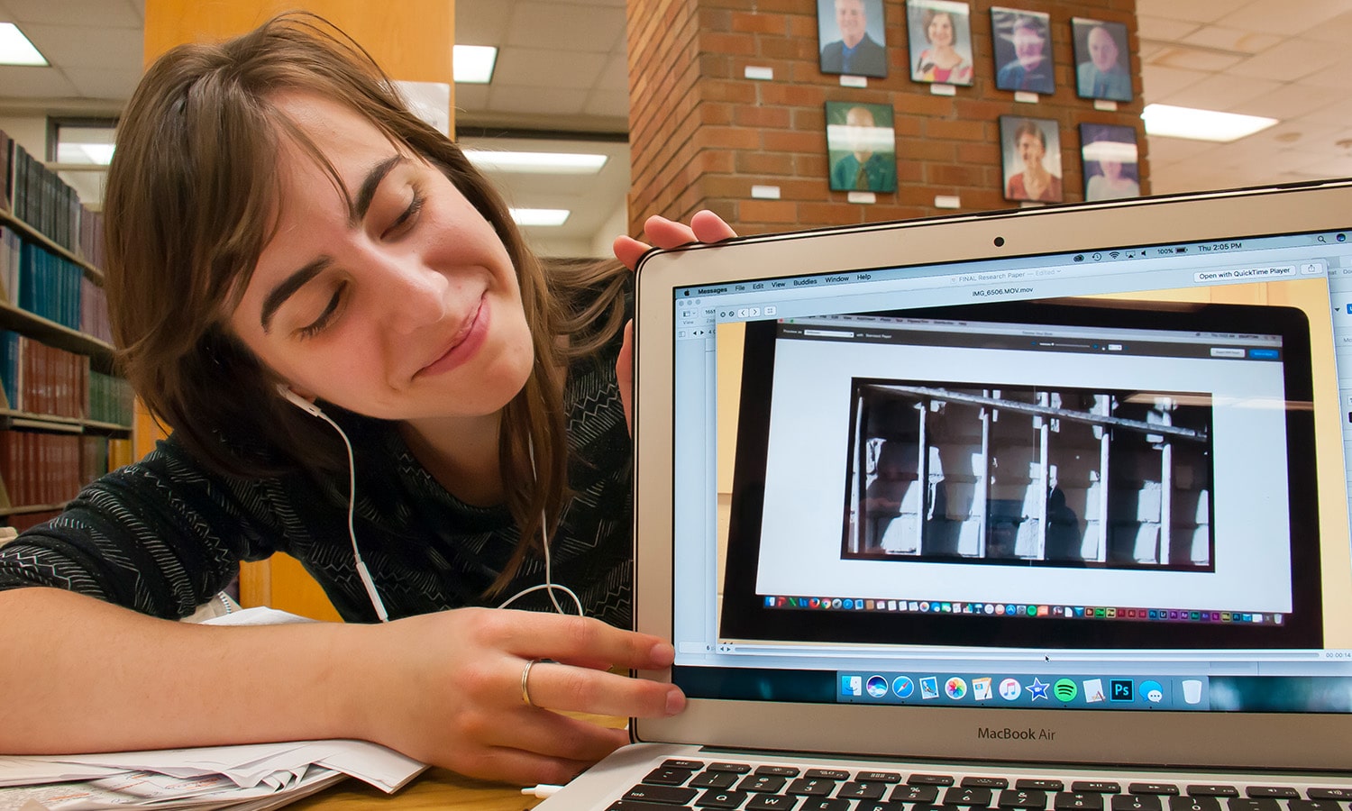 a woman sitting in front of a laptop computer a woman sitting in front of a laptop computer