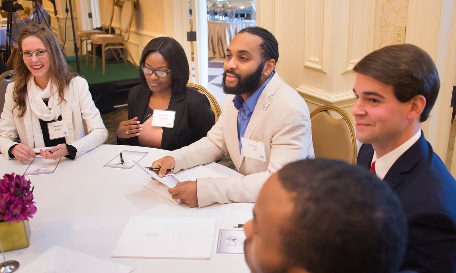 a group of people sitting at a table