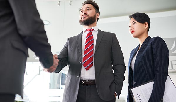 a man wearing a suit and tie a man wearing a suit and tie