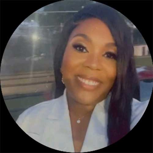 a close up of a smiling woman in front of a window