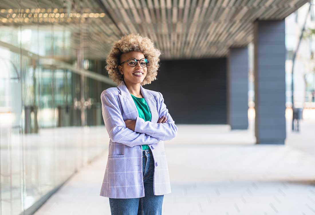 a little girl Higher Education Professor standing in front of a building