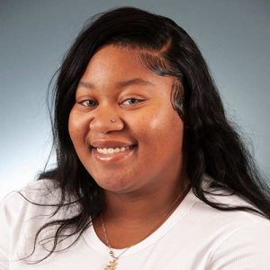 A Woman Smiling For The Camera