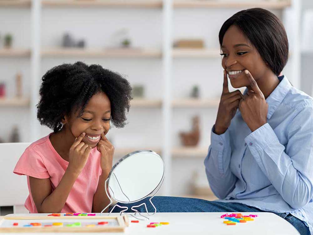 a woman sitting at a table eating food