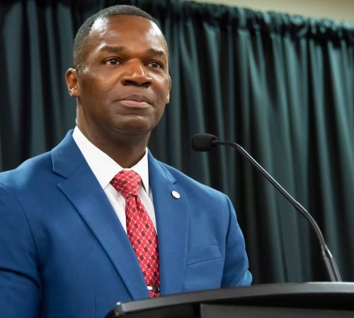 A Man Wearing A Suit And Tie