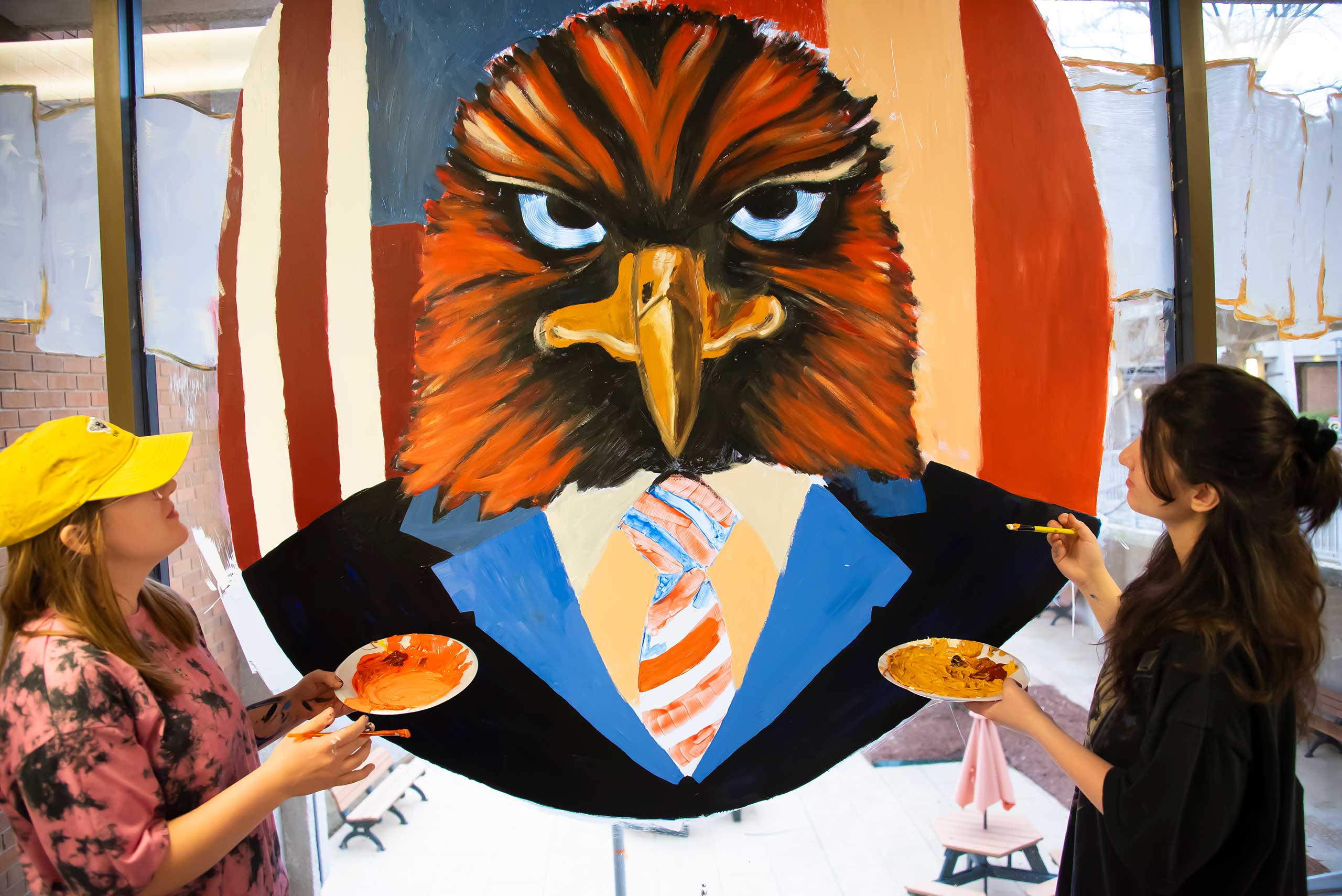 a woman standing in front of a mirror