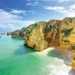 a body of water with a mountain in the background