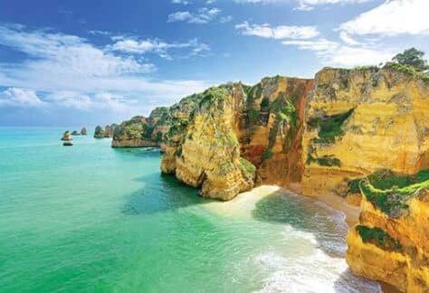 a body of water with a mountain in the background
