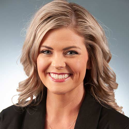 a woman smiling for the camera