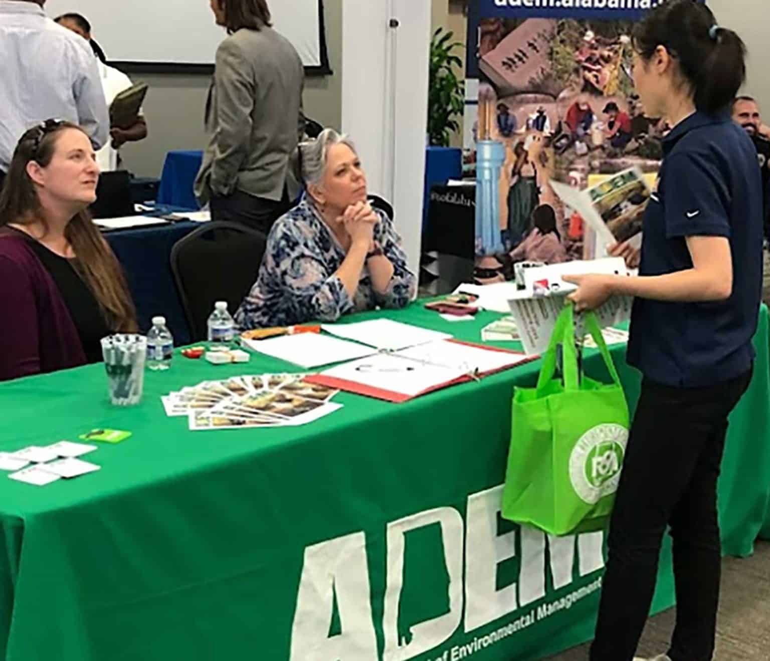 Students Visit The ADEM Table At A Career Fair.